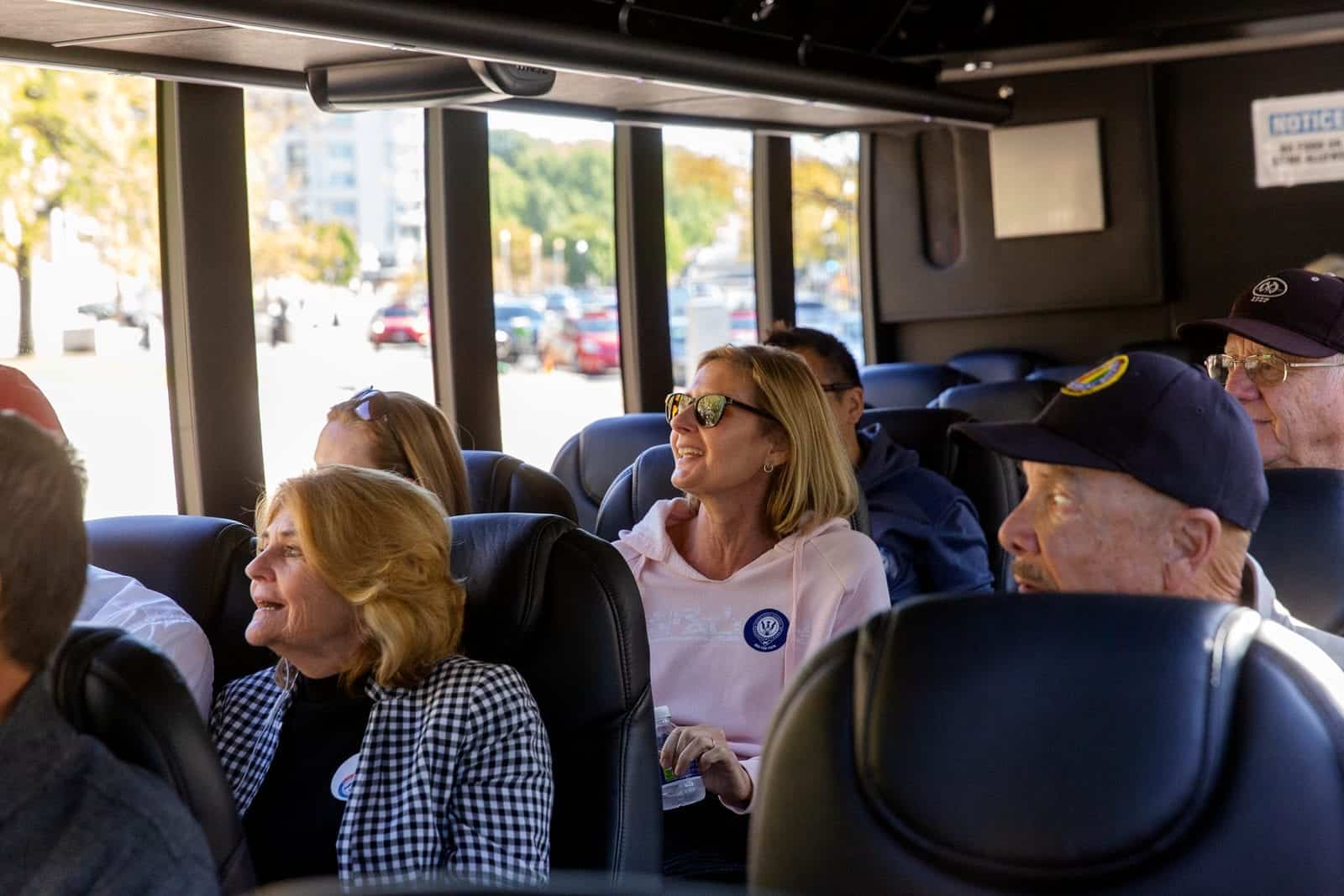 Tour Guide With a Tour Group on the Bus